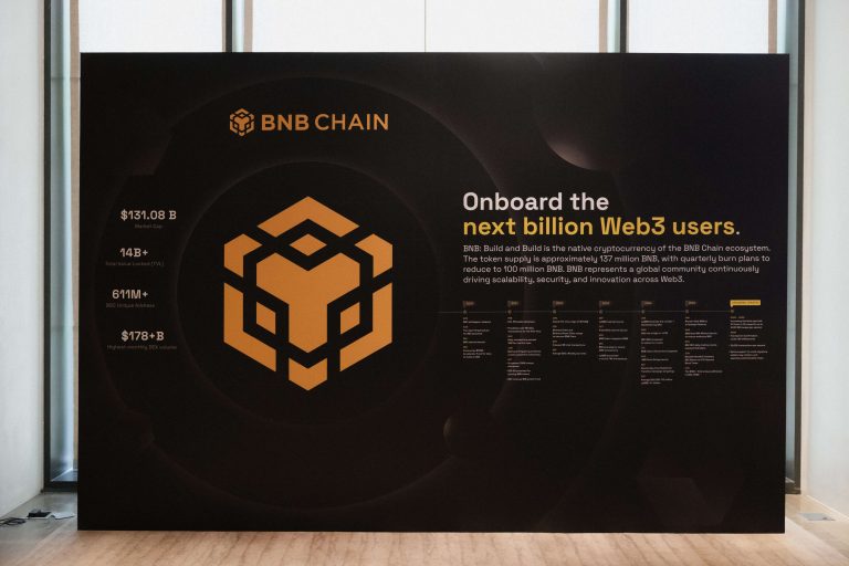 Large black and gold BNB Chain infographic display board titled "Onboard the next billion Web3 users," showcasing key ecosystem statistics, timeline milestones, and the BNB logo.