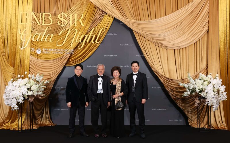 From left to right, Varit Bulakul, Chan Bulakul (Chairman of EXCO Committee), Vichada Bulakul, and Varut Bulakul (CEO of The Brooker Group PCL) at the BNB 1K Gala Night backdrop, hosted by The Brooker Group to celebrate reaching 1,000 BNB holdings.